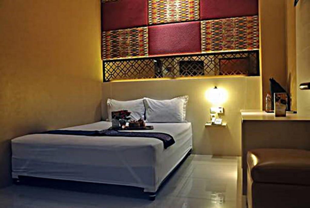 Metro House Hotel Surabaya Phòng bức ảnh